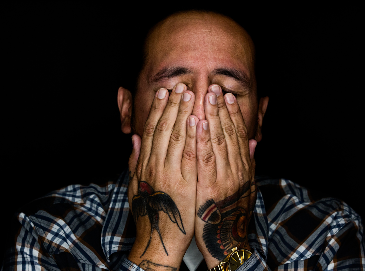 Photo of a man covering his face. Are you struggling with unsolved trauma symptoms? A trauma therapist in the Orlando area discusses Complex PTSD symptoms and how to relieve them.