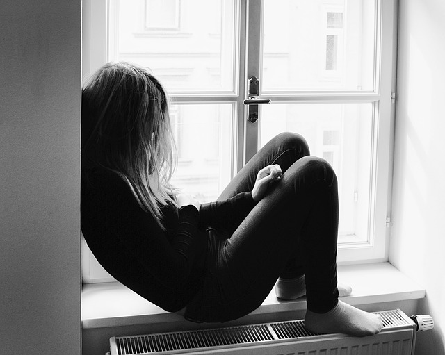 Image of a young adult sitting in a window sill. Are you looking for "counseling for teens near me" in Winter Park, FL? Then our Orlando therapist for teens can help! We offer therapy for teens to help address depression in teens. Call today to get started!